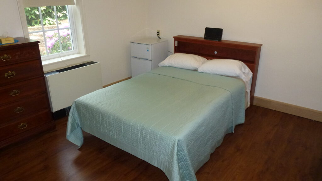 A student room at The Seeing Eye. Each room has a full-sized bed and a private bathroom.