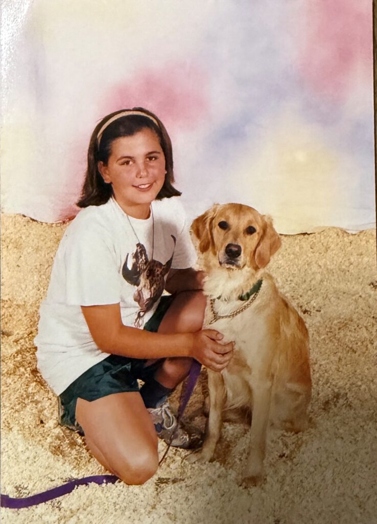 Twelve-year-old Laura with her first Seeing Eye puppy, Emily, a golden retriever.